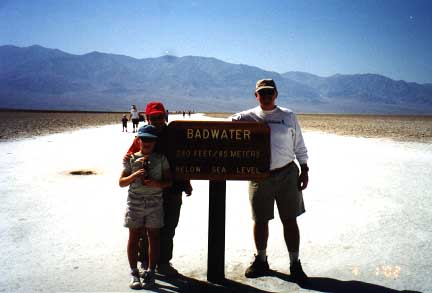 Farmer Family posing at Badwater sign